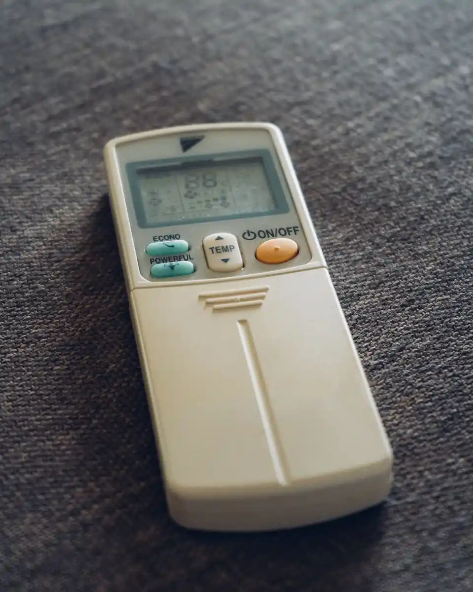 Air conditioner remote control on a fabric surface