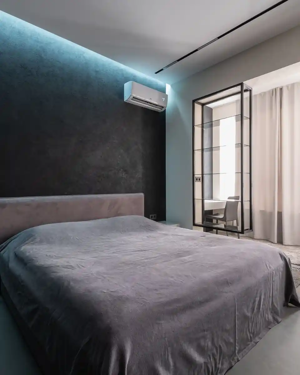 Bedroom with a wall-mounted air conditioner