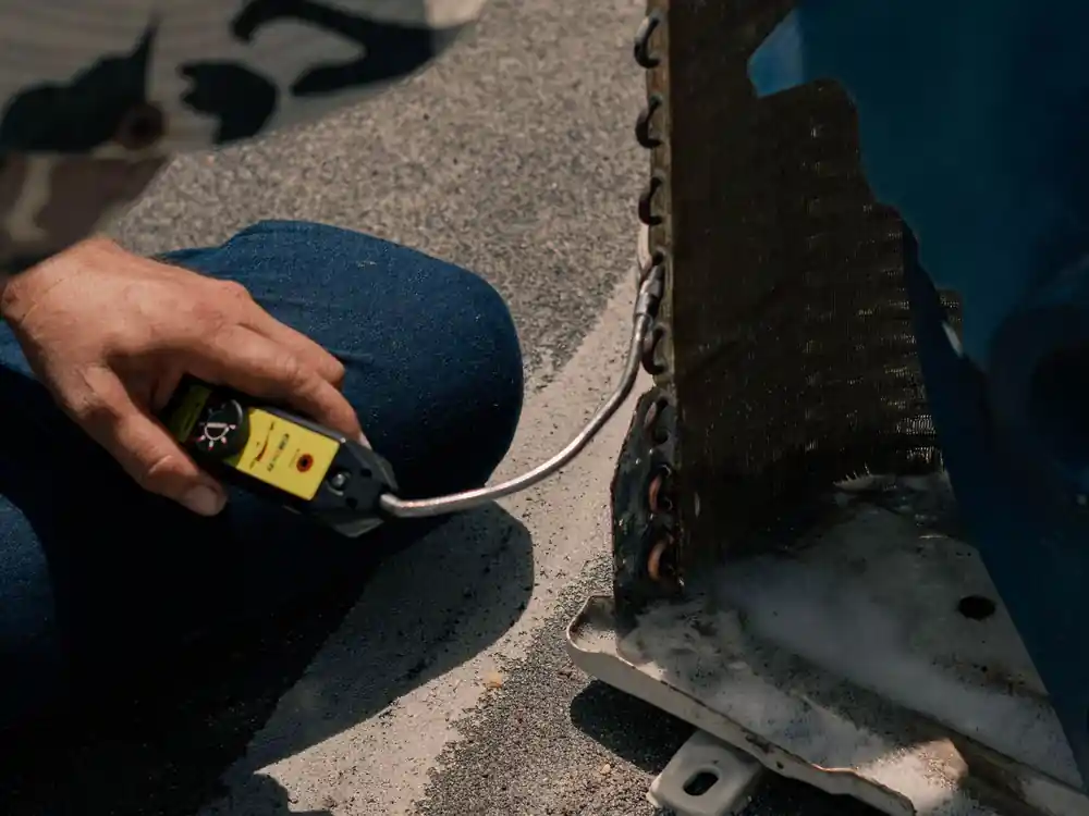 Technician working on an air conditioning unit