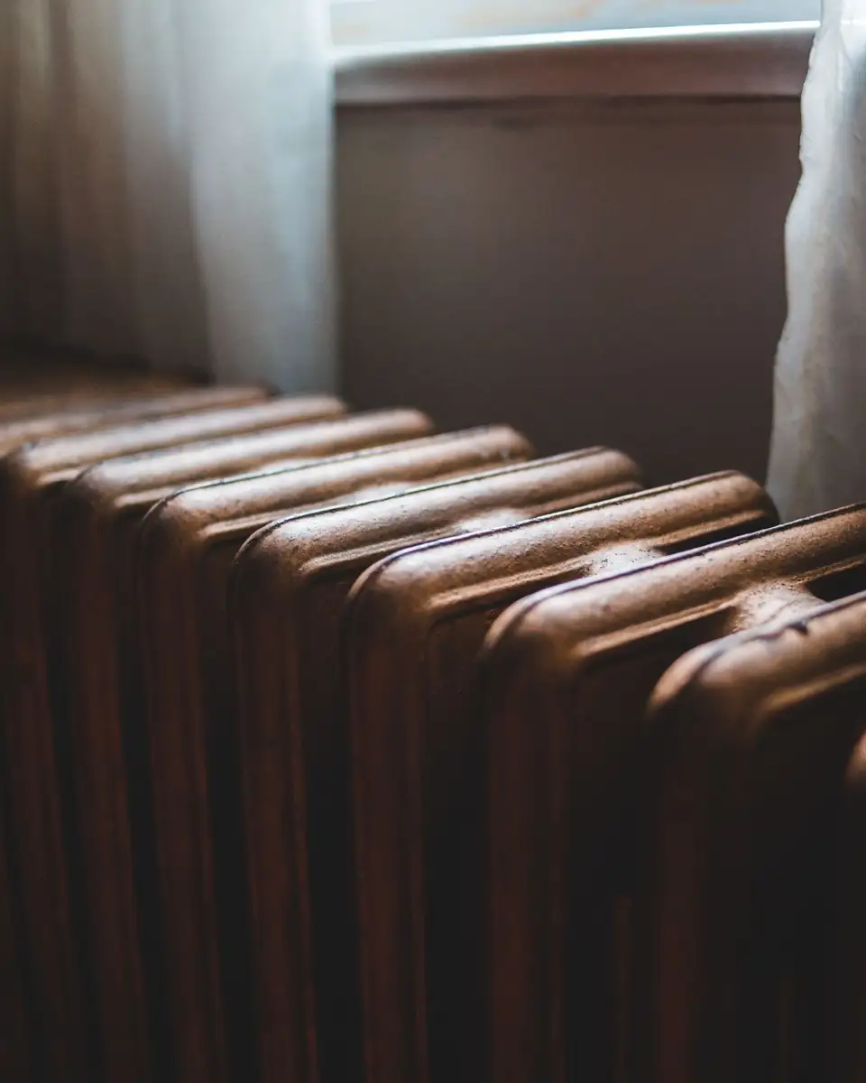 Cast-iron radiator beside a window