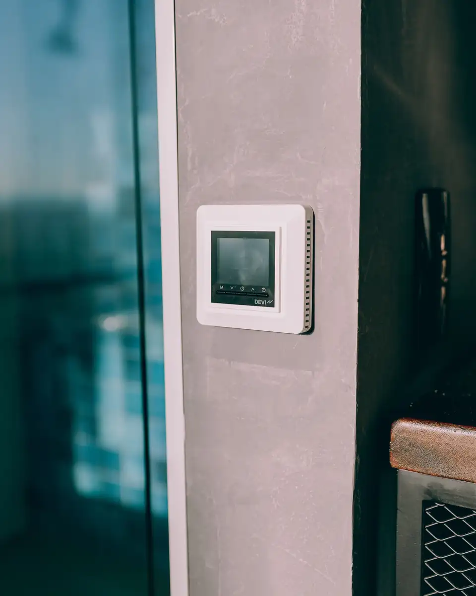Smart thermostat on a wall