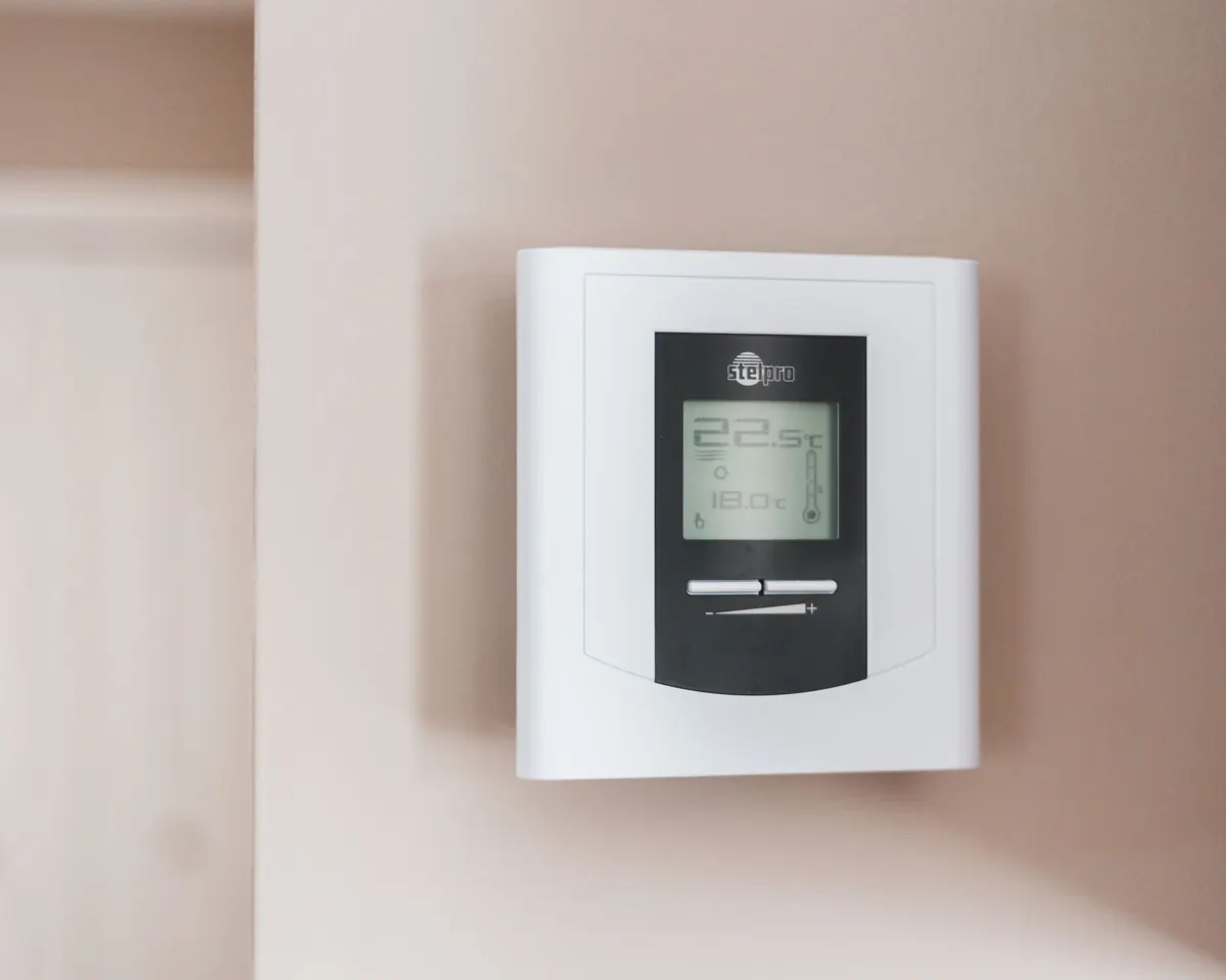 Digital wall thermostat for home heating and cooling