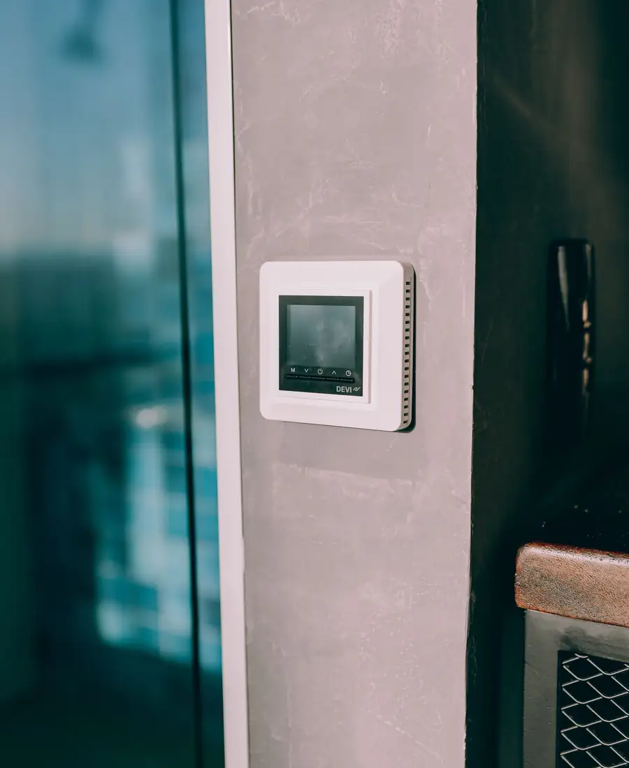 Smart thermostat on a wall